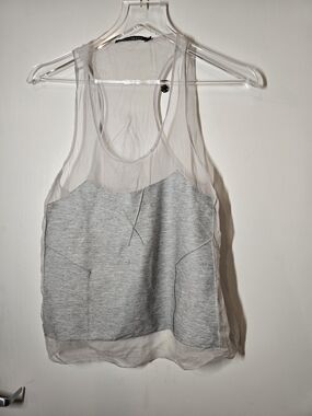 From The Runways In Brazil, A Sheer Overlay Gray Tank Top with Knit Front Panel